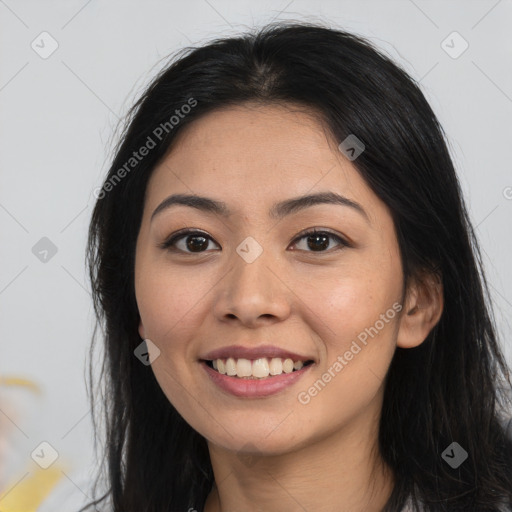 Joyful asian young-adult female with long  brown hair and brown eyes