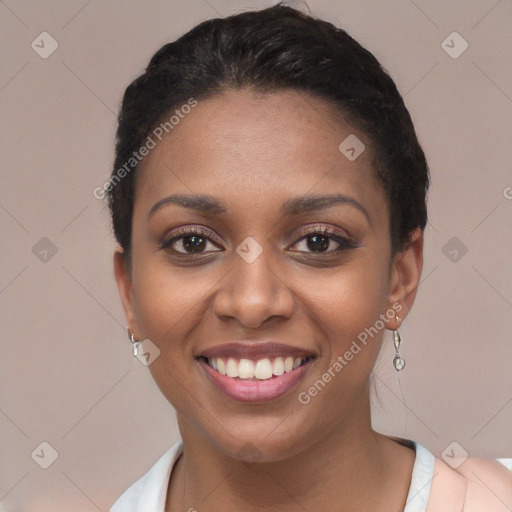 Joyful black young-adult female with short  black hair and brown eyes