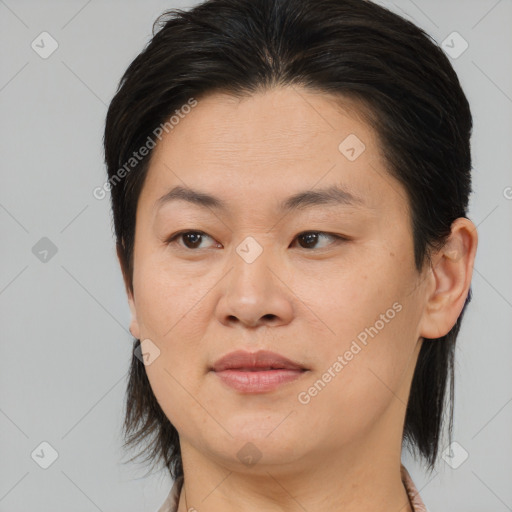 Joyful asian adult female with medium  brown hair and brown eyes