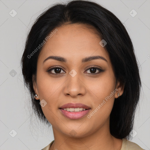 Joyful latino young-adult female with long  black hair and brown eyes