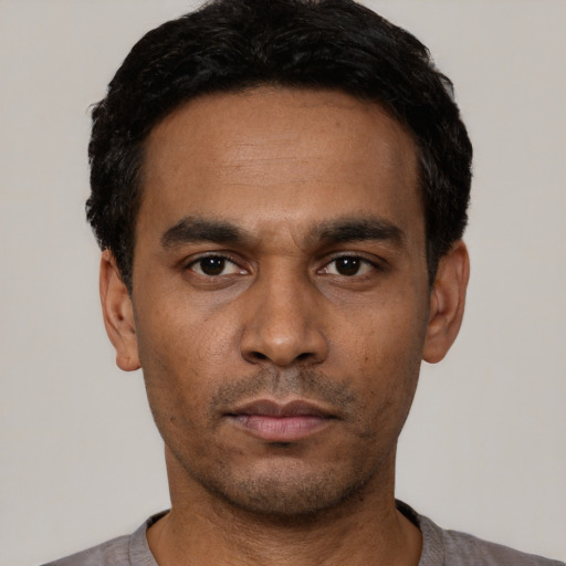 Neutral latino young-adult male with short  black hair and brown eyes
