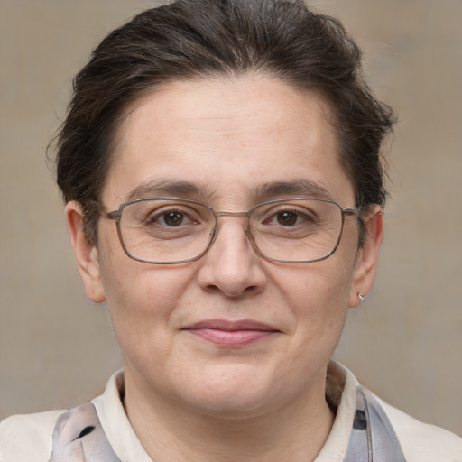 Joyful white adult female with short  brown hair and brown eyes