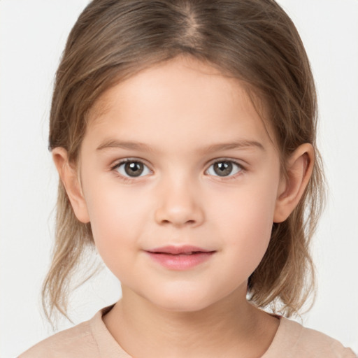 Joyful white child female with medium  brown hair and brown eyes