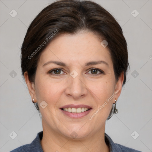 Joyful white adult female with medium  brown hair and brown eyes