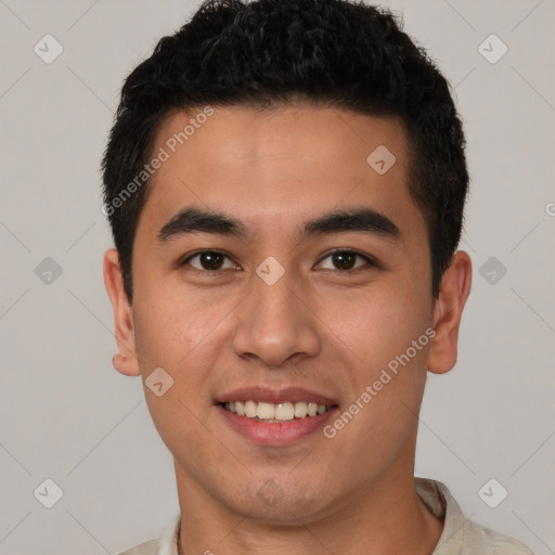 Joyful latino young-adult male with short  brown hair and brown eyes