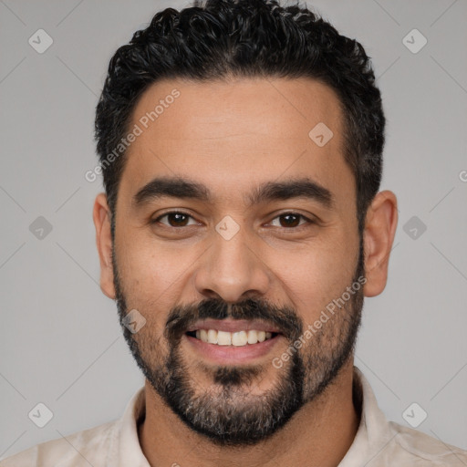 Joyful latino young-adult male with short  black hair and brown eyes