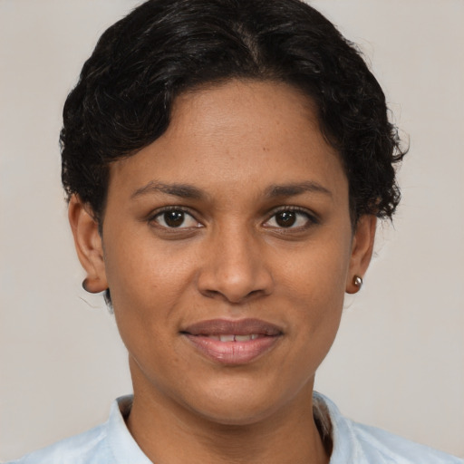Joyful latino young-adult female with short  brown hair and brown eyes