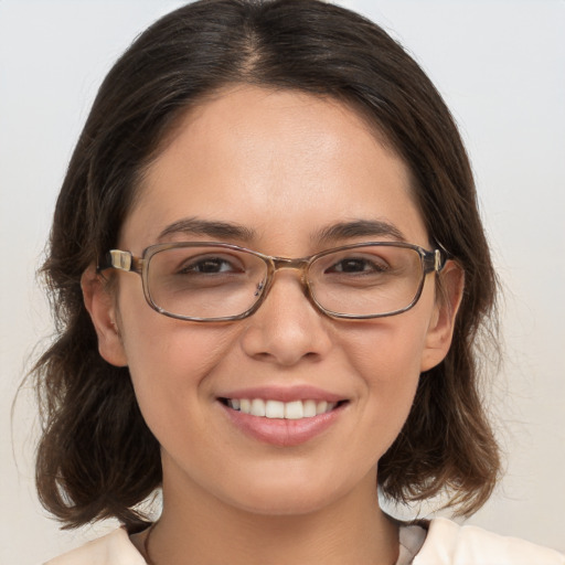 Joyful white young-adult female with medium  brown hair and brown eyes