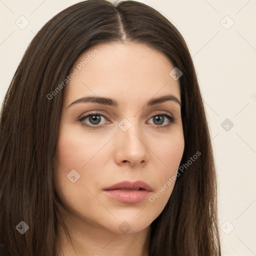 Neutral white young-adult female with long  brown hair and brown eyes