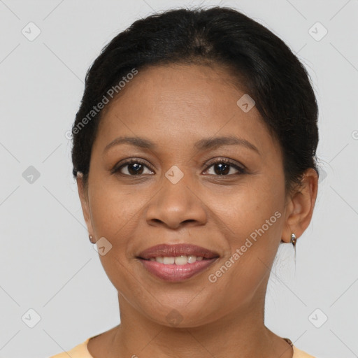 Joyful latino adult female with short  brown hair and brown eyes