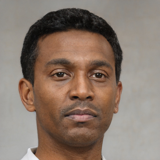 Neutral black young-adult male with short  brown hair and brown eyes