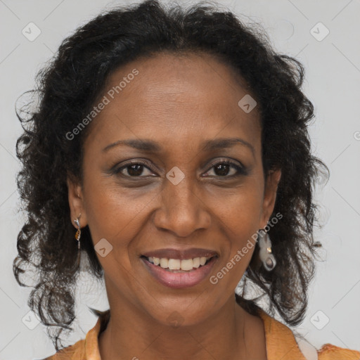Joyful black adult female with long  brown hair and brown eyes
