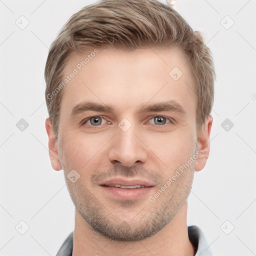 Joyful white young-adult male with short  brown hair and grey eyes