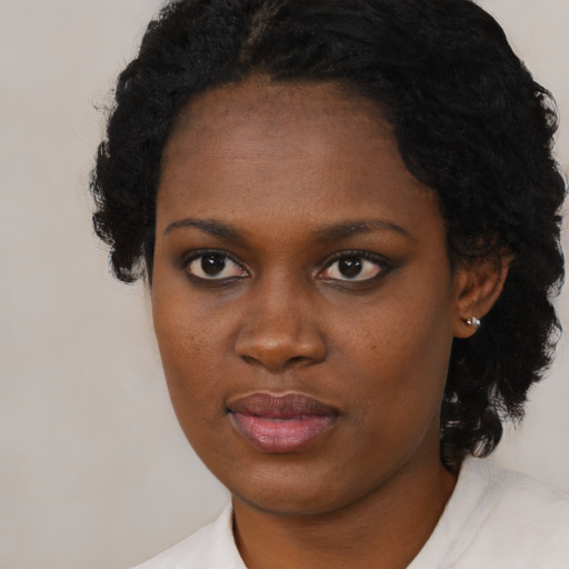 Neutral black young-adult female with medium  black hair and brown eyes