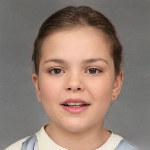 Joyful white child female with short  brown hair and brown eyes