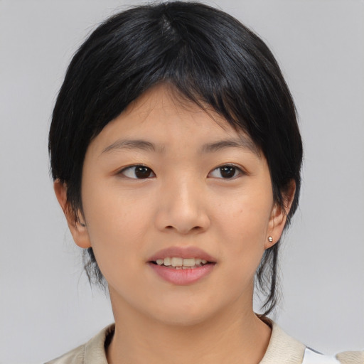 Joyful asian young-adult female with medium  brown hair and brown eyes