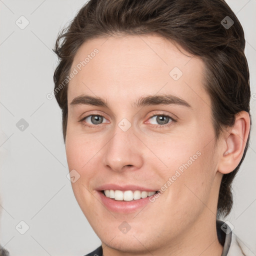 Joyful white young-adult female with medium  brown hair and grey eyes