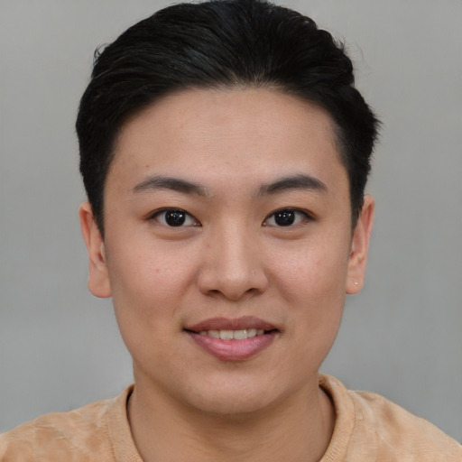 Joyful asian young-adult female with short  brown hair and brown eyes