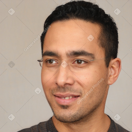 Joyful white young-adult male with short  black hair and brown eyes