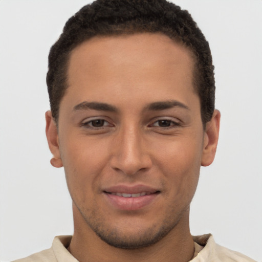 Joyful latino young-adult male with short  brown hair and brown eyes