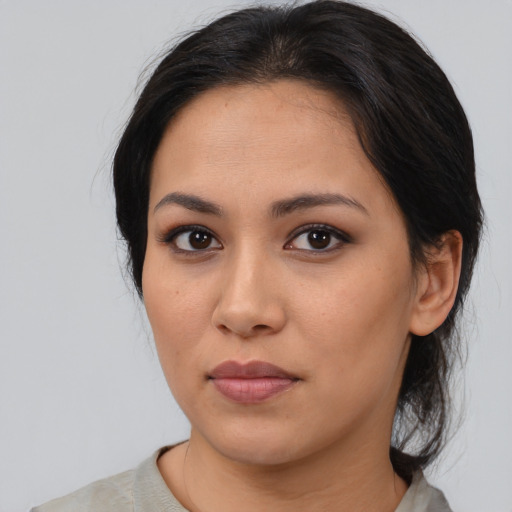 Neutral asian young-adult female with medium  brown hair and brown eyes