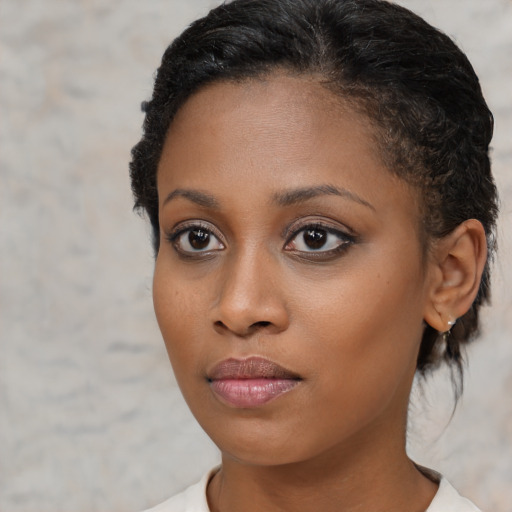 Neutral black young-adult female with short  brown hair and brown eyes