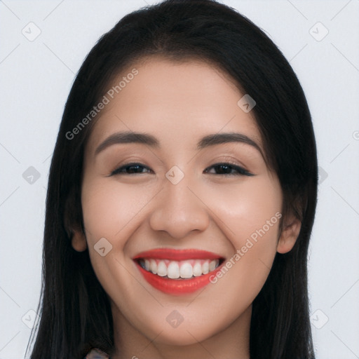 Joyful white young-adult female with long  black hair and brown eyes