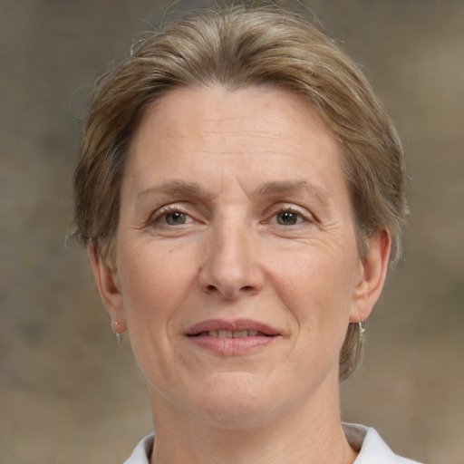 Joyful white middle-aged female with short  brown hair and brown eyes