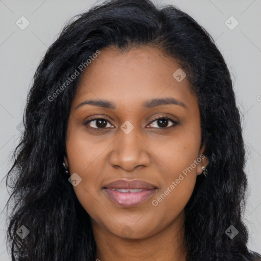 Joyful black young-adult female with long  black hair and brown eyes