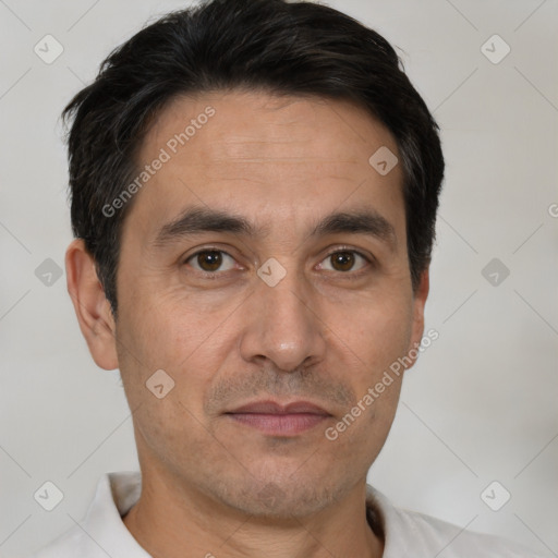 Joyful white adult male with short  brown hair and brown eyes