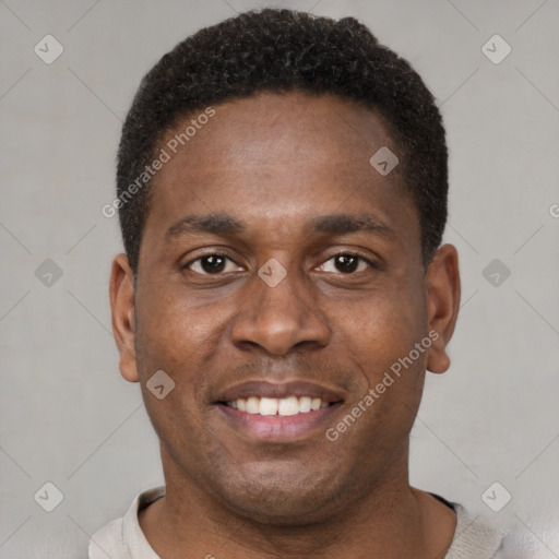 Joyful black young-adult male with short  black hair and brown eyes