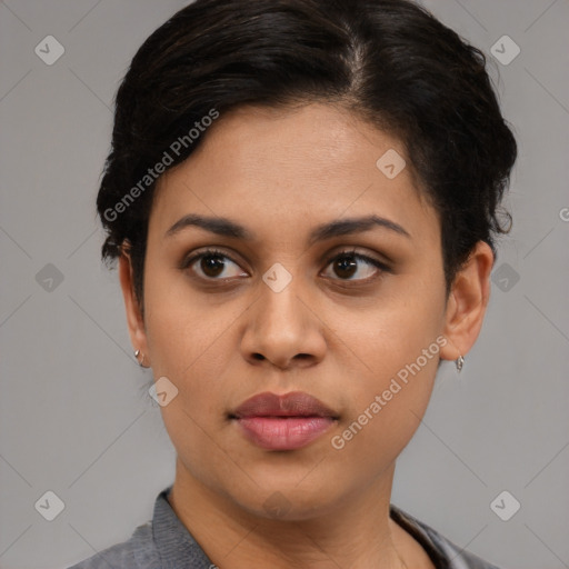 Joyful latino young-adult female with short  brown hair and brown eyes