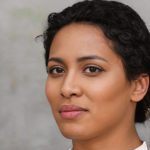 Neutral latino young-adult female with short  black hair and brown eyes