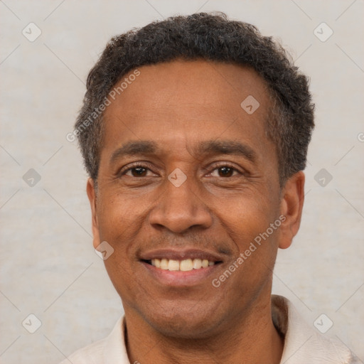 Joyful latino adult male with short  brown hair and brown eyes