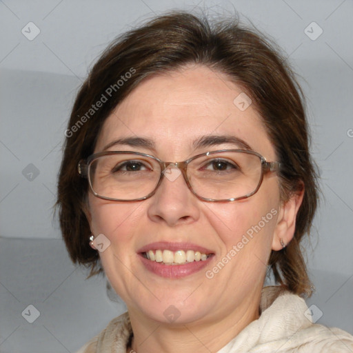 Joyful white adult female with medium  brown hair and blue eyes