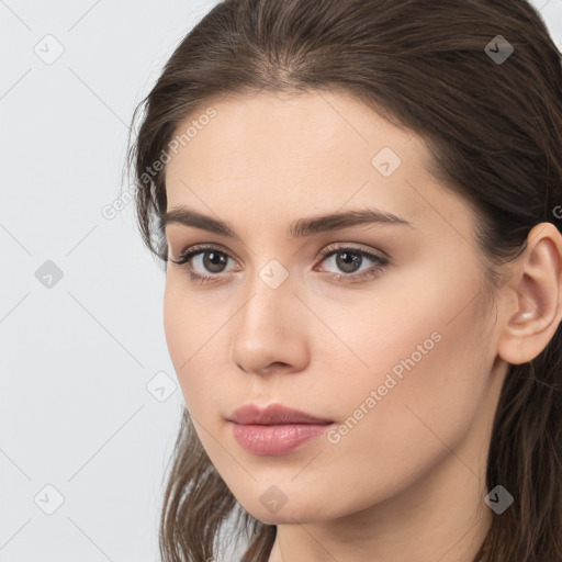 Neutral white young-adult female with long  brown hair and brown eyes