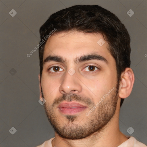 Joyful white young-adult male with short  black hair and brown eyes