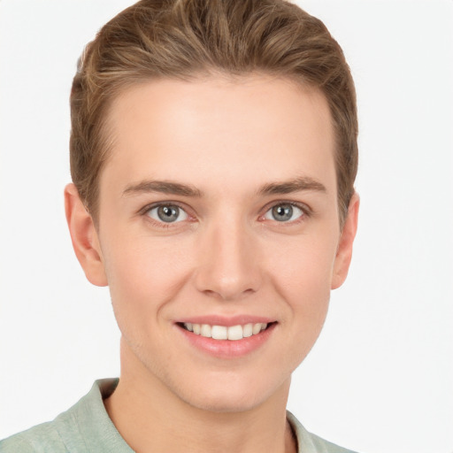 Joyful white young-adult female with short  brown hair and grey eyes