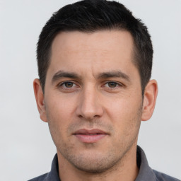 Neutral white young-adult male with short  black hair and brown eyes