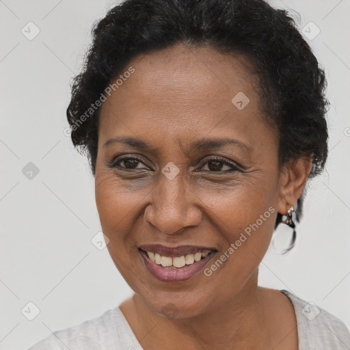 Joyful black adult female with short  brown hair and brown eyes