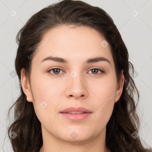 Neutral white young-adult female with long  brown hair and brown eyes