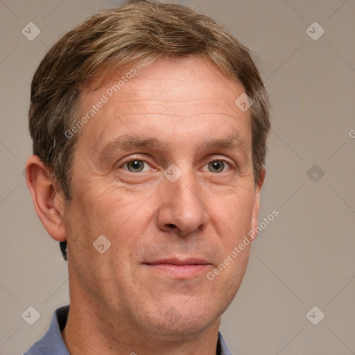 Joyful white adult male with short  brown hair and grey eyes