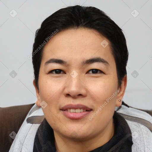 Joyful asian young-adult female with short  black hair and brown eyes