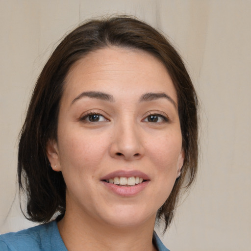 Joyful white young-adult female with medium  brown hair and brown eyes