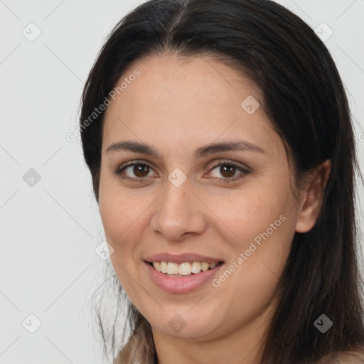 Joyful white young-adult female with long  brown hair and brown eyes