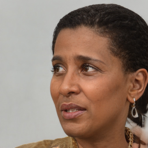 Neutral black adult female with short  black hair and brown eyes