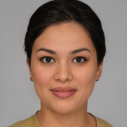 Joyful white young-adult female with medium  brown hair and brown eyes