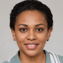 Joyful latino young-adult female with short  brown hair and brown eyes