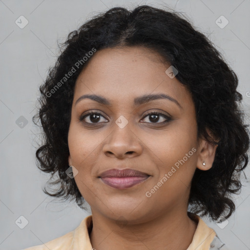 Joyful black young-adult female with medium  brown hair and brown eyes