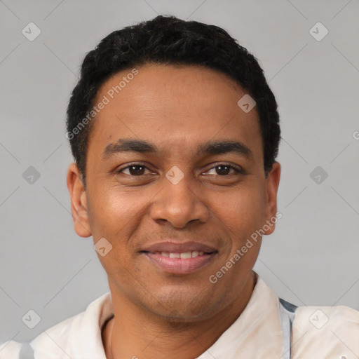 Joyful latino young-adult male with short  black hair and brown eyes